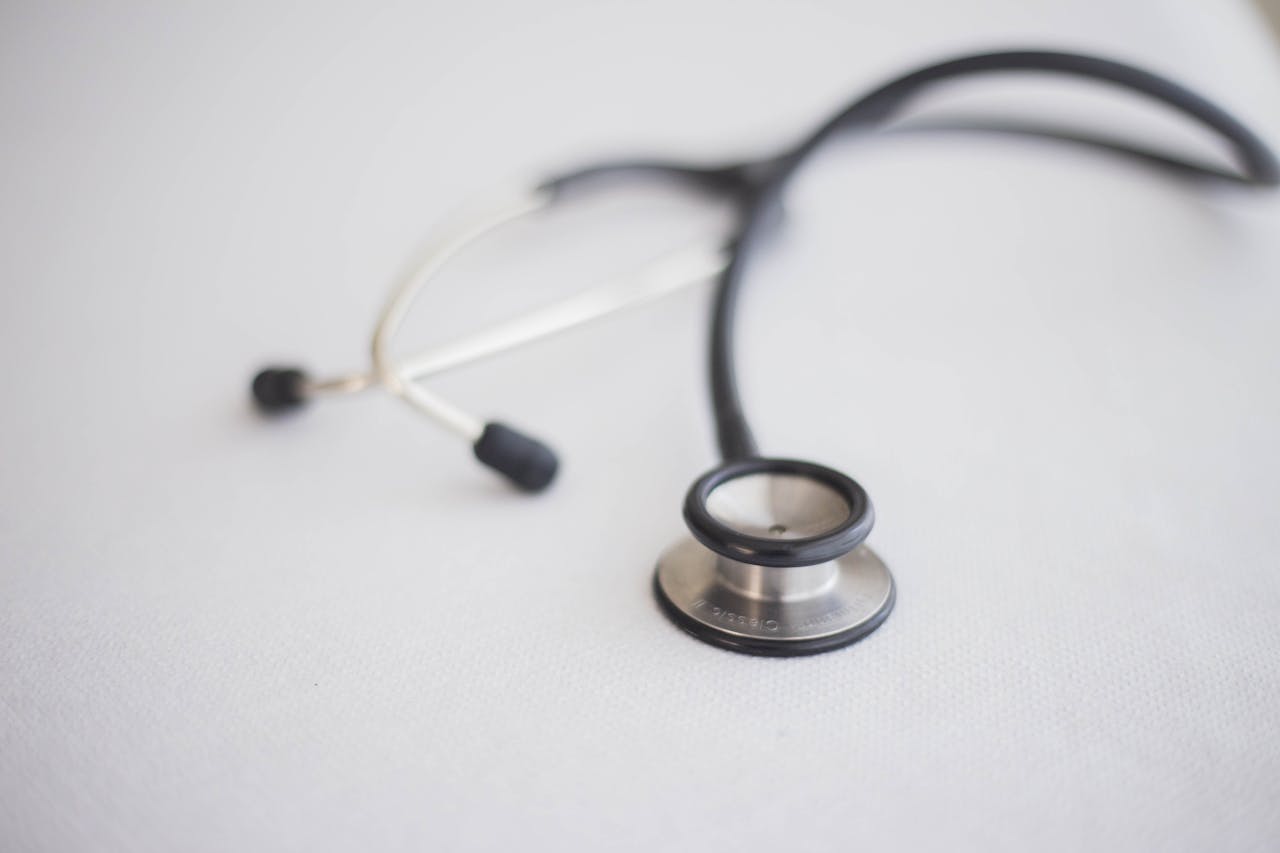 A detailed close-up photo of a stethoscope on a clean white background, ideal for health topics.